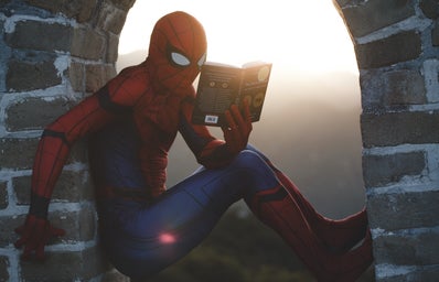 spider-man reading a book