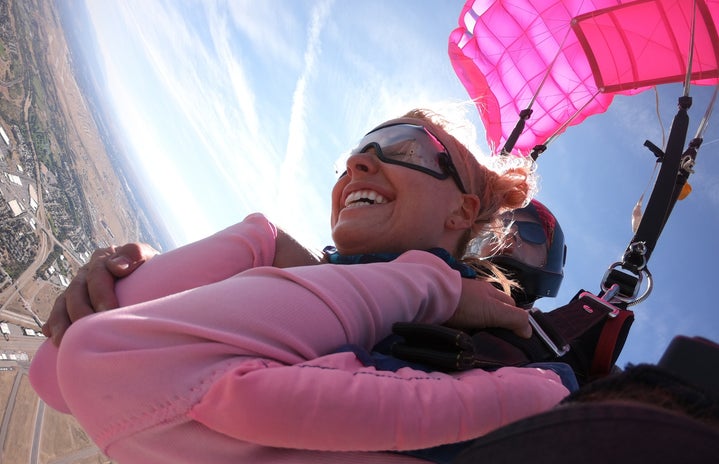 Madison Skydiving with her pink parachute