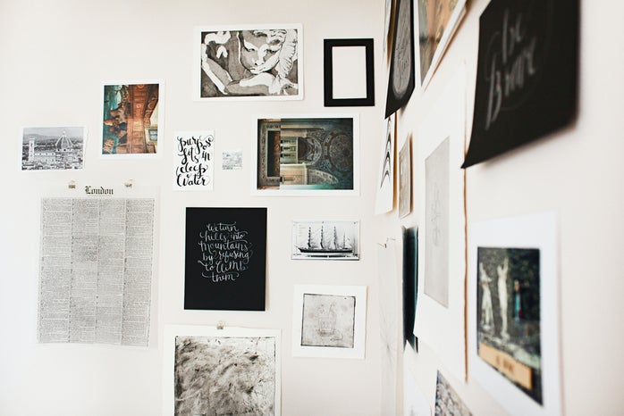prints and art hanging on wall