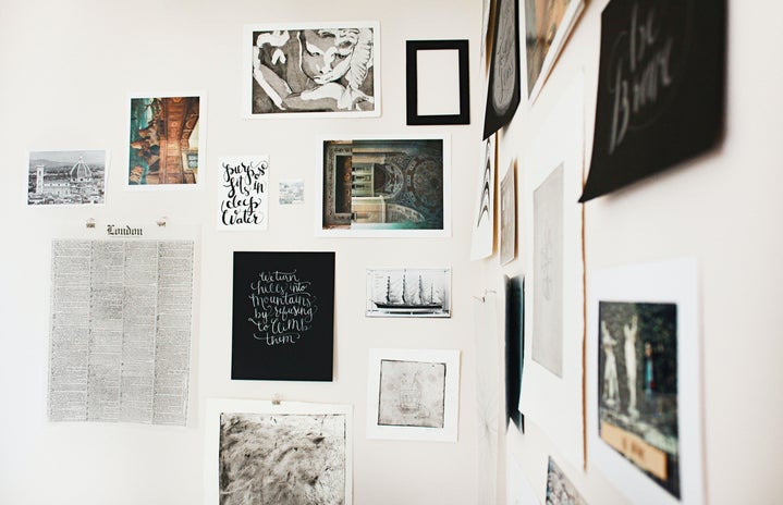 prints and art hanging on wall
