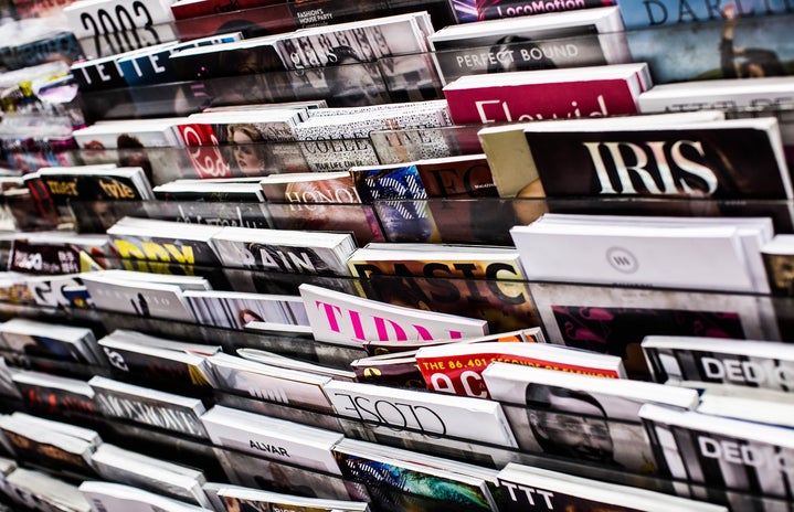 a variety of magazines on a shelf