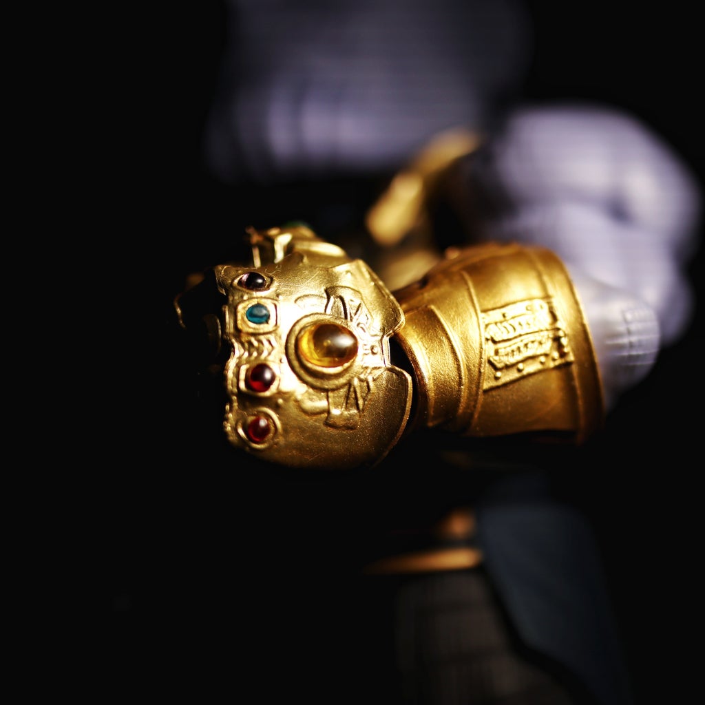 Model of Thanos\' gold glove with the infinity rings