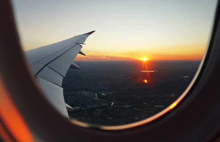 sunset outside airplane window by Eva Darron via Unsplash?width=719&height=464&fit=crop&auto=webp