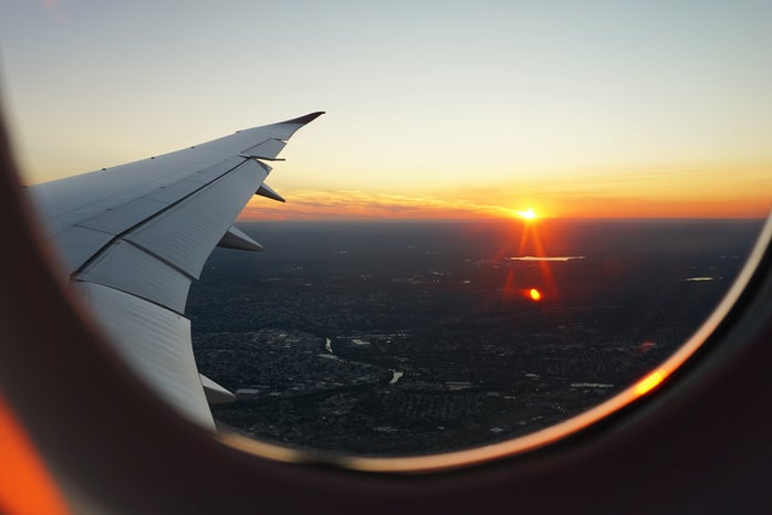 sunset outside airplane window by Eva Darron via Unsplash?width=698&height=466&fit=crop&auto=webp
