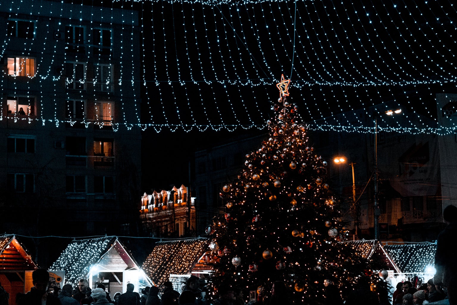Christmas tree and lights over a Christmas market