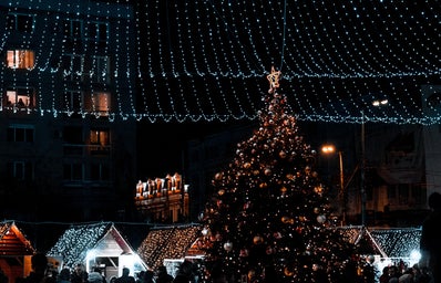 Christmas tree and lights over a Christmas market