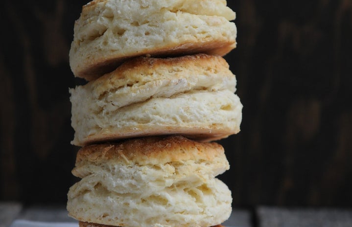 stack of four biscuits on cloth on table