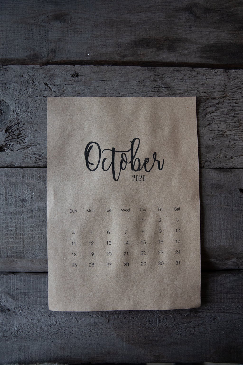 October Calendar On Wooden Surface