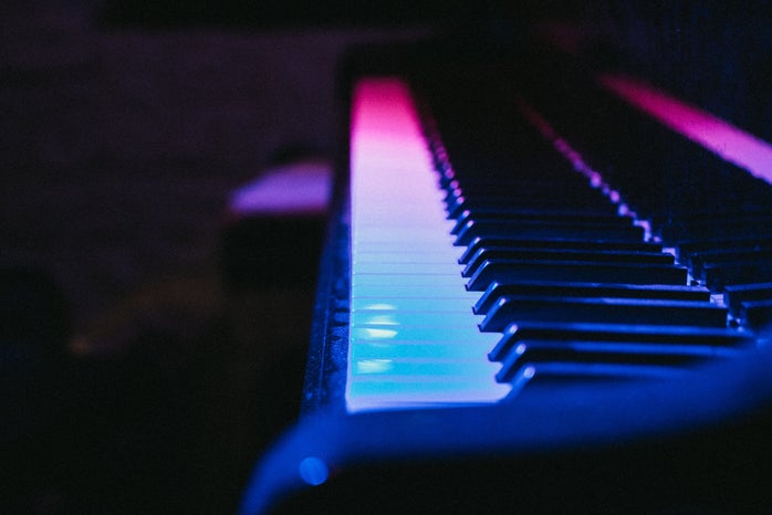 Piano with blue and pink lighting