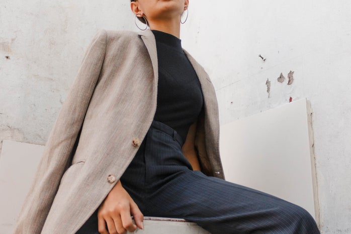 woman wearing suit and button up fall fashion