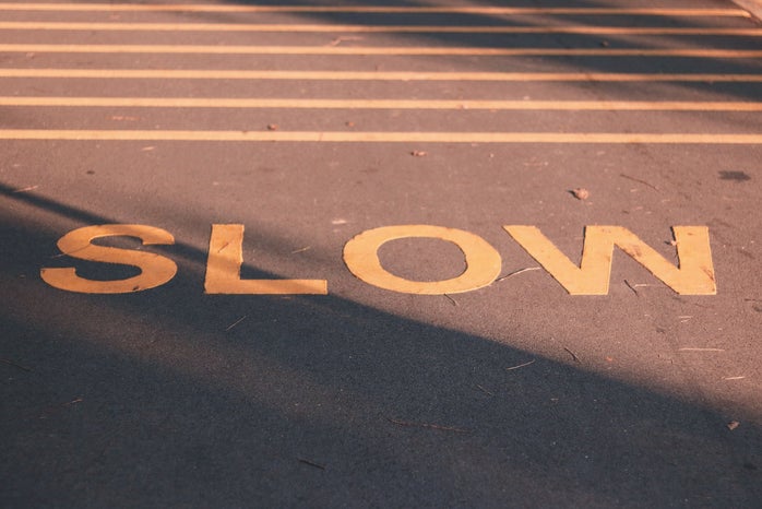 slow sign on the road by Song Kaiyue?width=698&height=466&fit=crop&auto=webp