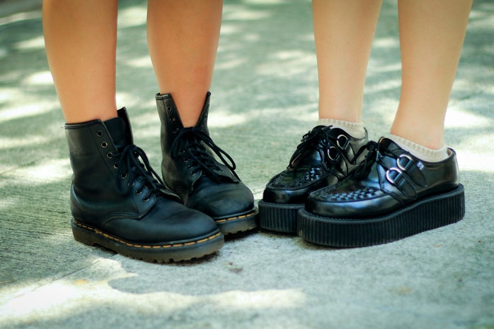 two pairs of platform black boots