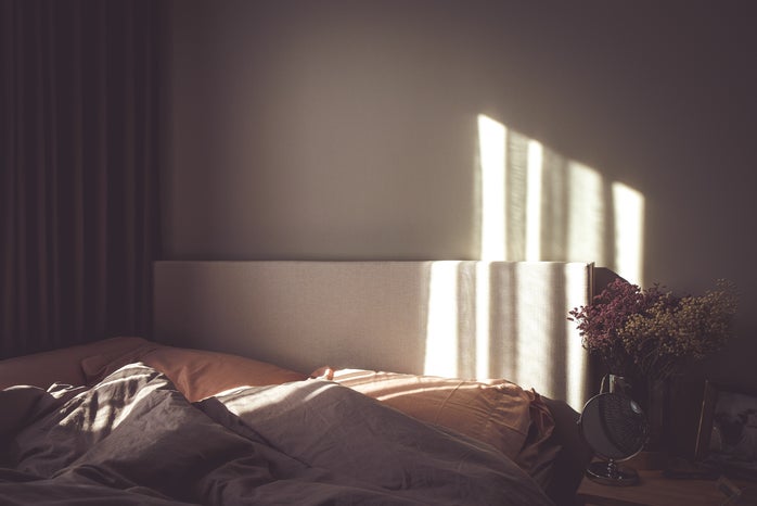 empty bed with sunlight on wall by Mink Mingle via Unsplash?width=698&height=466&fit=crop&auto=webp