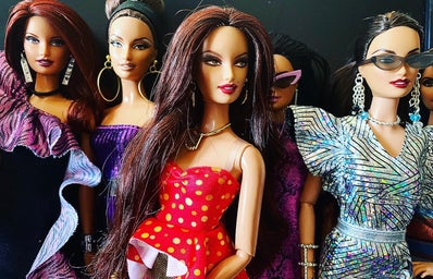 Four fabulously-dressed fashion dolls.