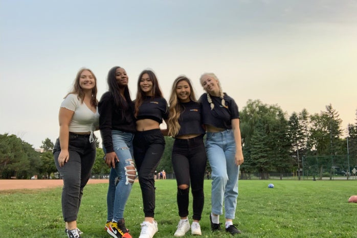 group of girl friends in a field