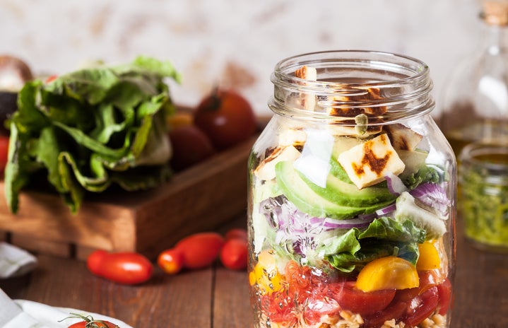 Lentil salad with fried cheese in a jar