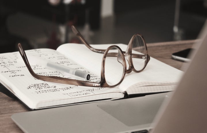 eyeglasses on notebook by Dan Dimmock via Unsplash?width=719&height=464&fit=crop&auto=webp