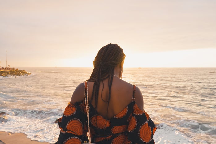 woman with braids on beach at sunset by Unsplash?width=698&height=466&fit=crop&auto=webp