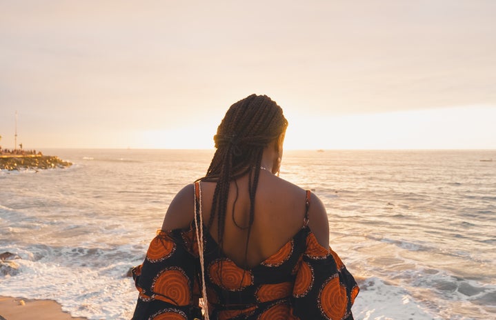woman with braids on beach at sunset by Unsplash?width=719&height=464&fit=crop&auto=webp