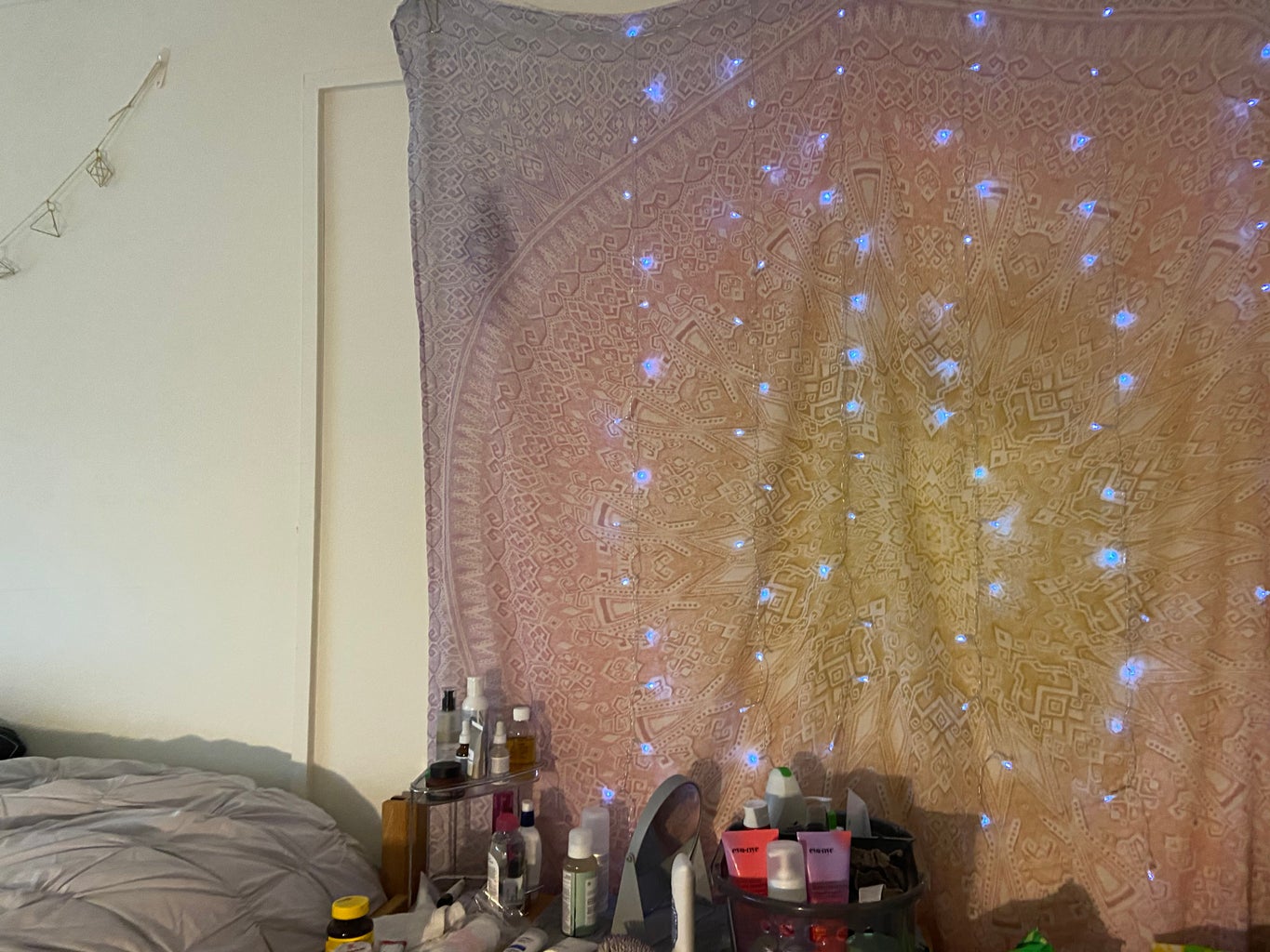 Tapestry and fairy lights in college dorm