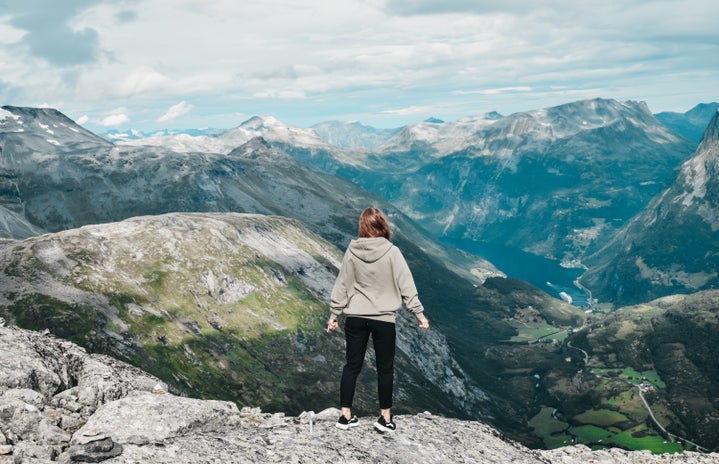 woman hiking in mountains by Darya Tryfanava on Unsplash?width=719&height=464&fit=crop&auto=webp