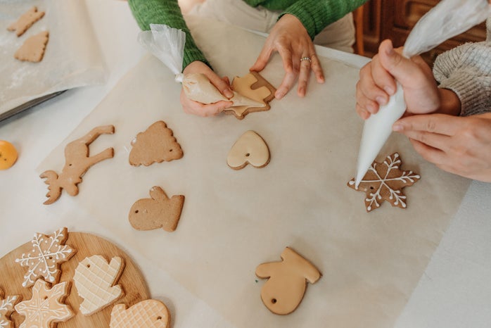 people decorating sugar cookies for Christmas