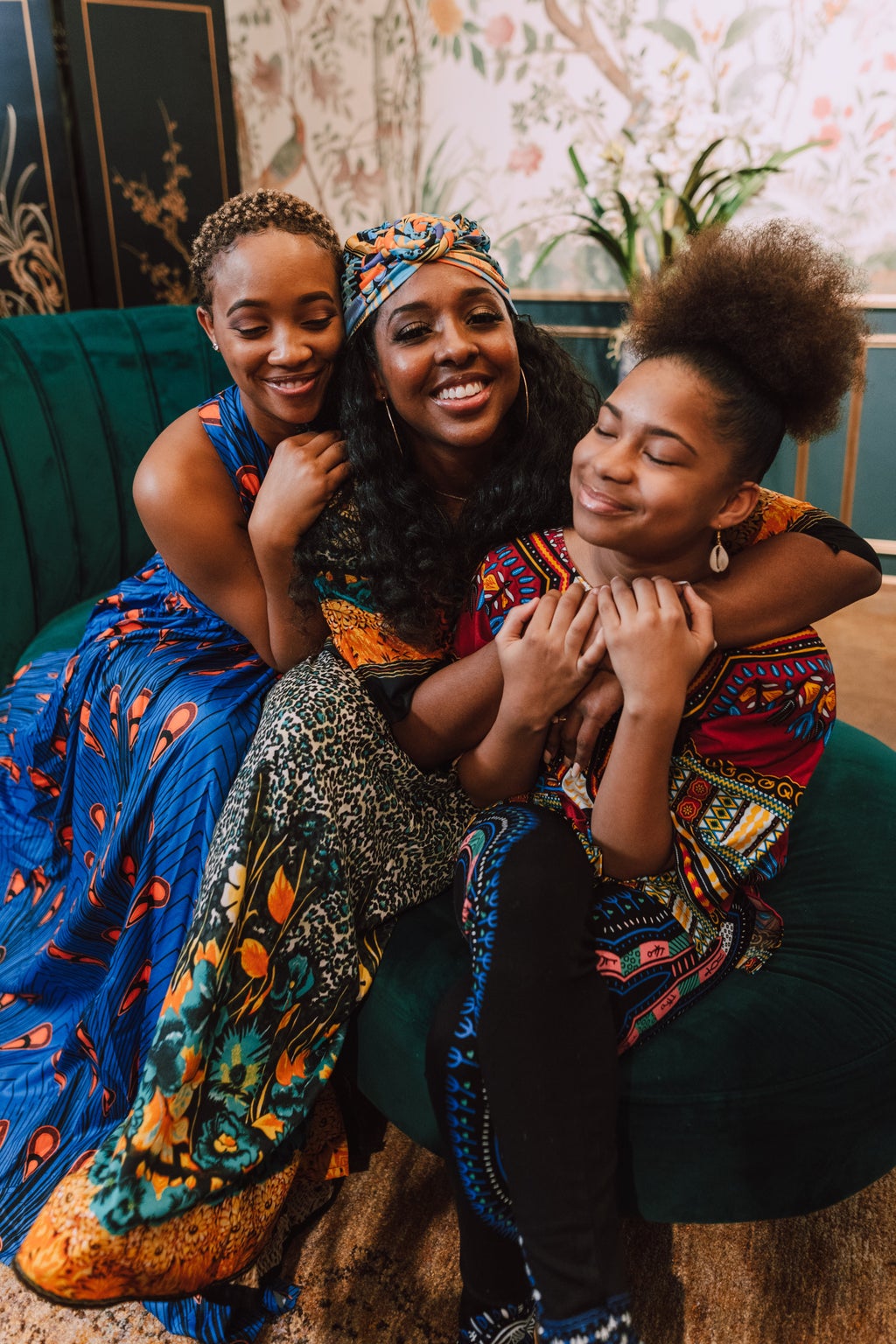 black women smiling and hugging