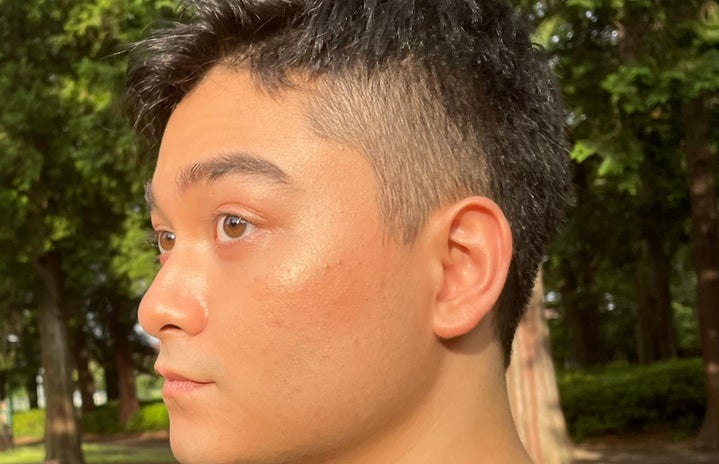 Men in makeup, glowy side profile photo