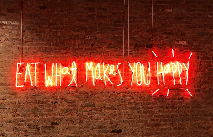 eat what makes you happy neon sign by Jon Tyson?width=719&height=464&fit=crop&auto=webp