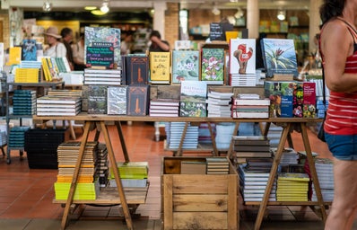 assorted books on a table in a bookstore