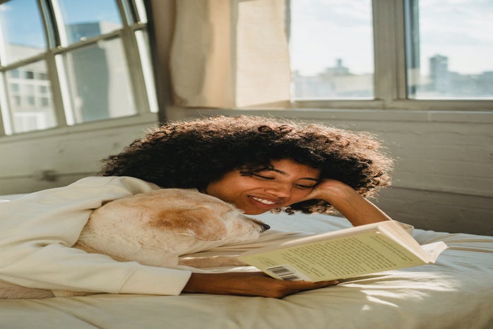 Women reading on bed with dog by Samson Kate?width=698&height=466&fit=crop&auto=webp