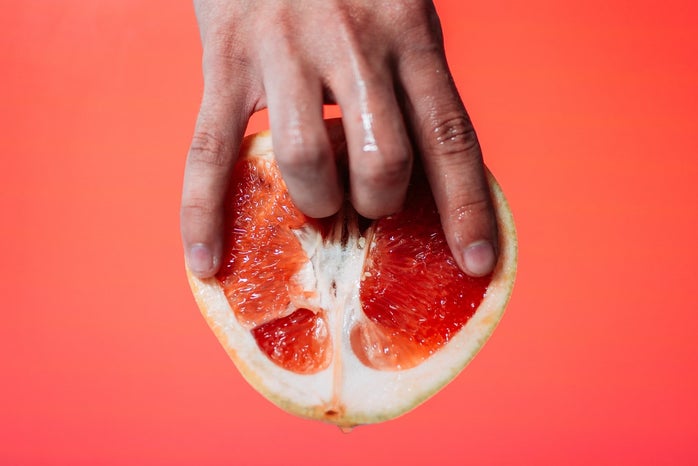 person holding red pomelo fruit by Taras Chernus?width=698&height=466&fit=crop&auto=webp