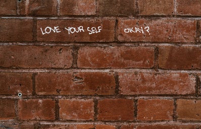 Love yourself written on wall
