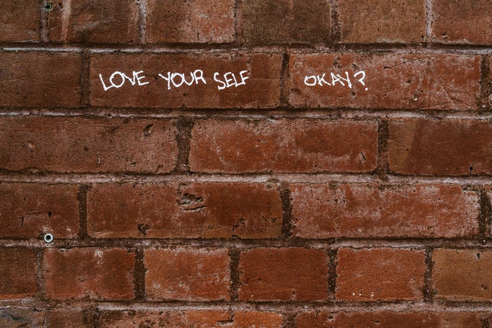 Love yourself written on wall by Nicole De Khors?width=698&height=466&fit=crop&auto=webp