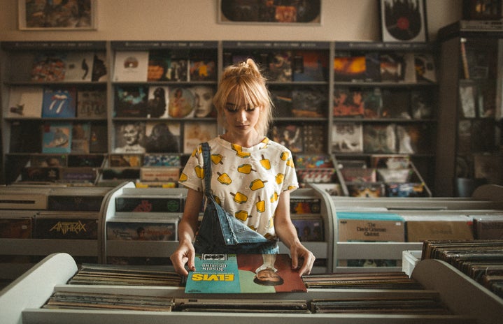 woman in record store by Jamakassi?width=719&height=464&fit=crop&auto=webp