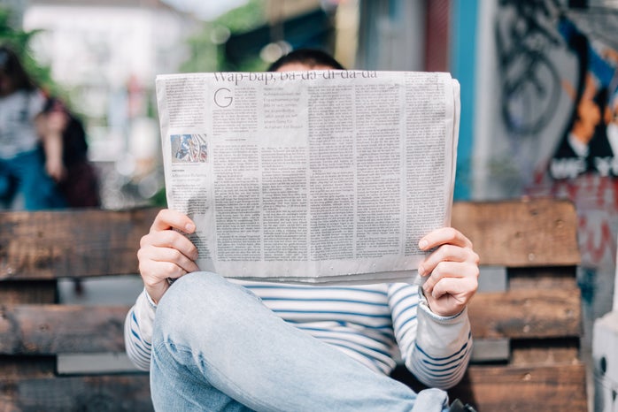 person reading the newspaper