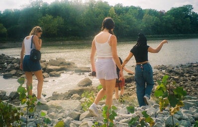 Friends of mine walking through a creek, taken on film