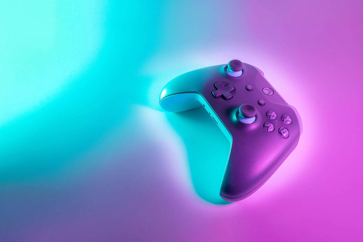 Black controller against a blue and purple background
