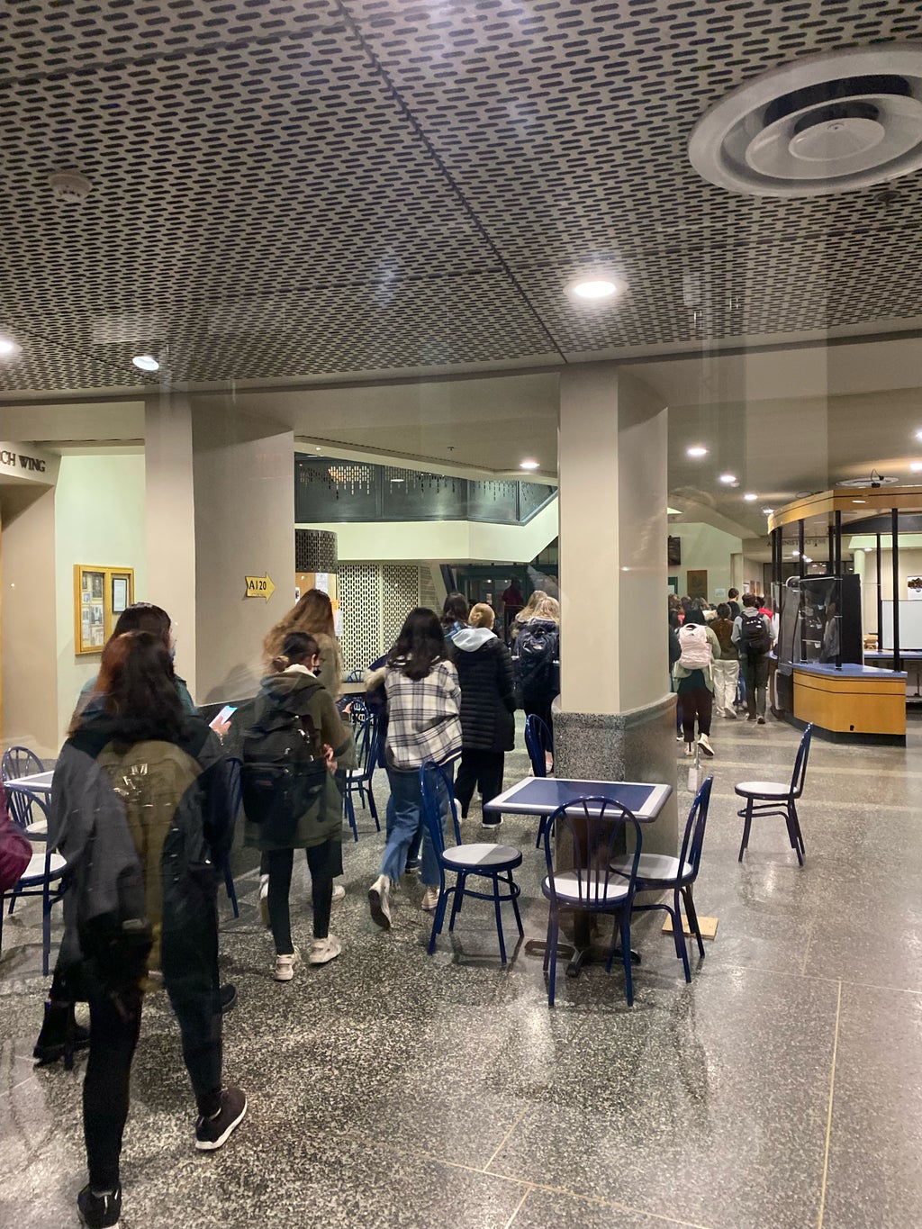 Line of students waiting to attend a club meeting