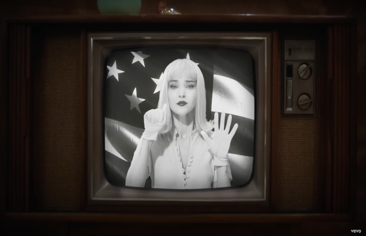 A screenshot of Dove Cameron in her \"Breakfast\" Music Video