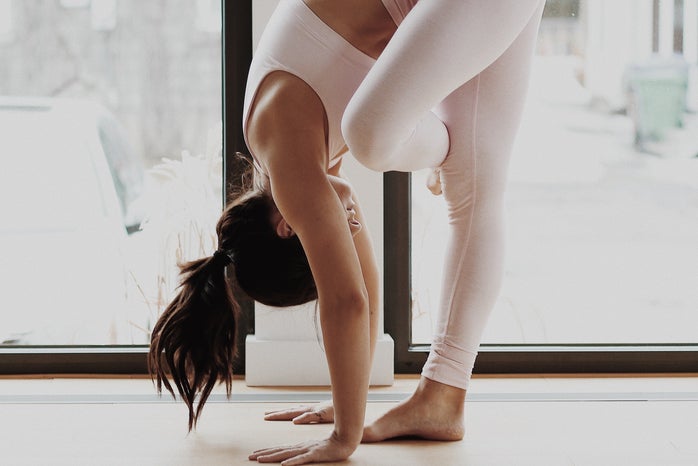Woman doing yoga by Mathilde Langevin from Unsplash?width=698&height=466&fit=crop&auto=webp