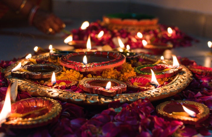 Beautiful combination of diyas and candles layed out for Diwali