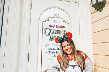 Victoria Cardoso with red Mickey ears