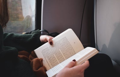 girl reading on train