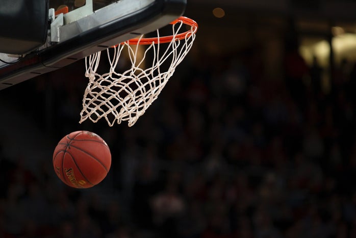 basketball falling through a basketball net.