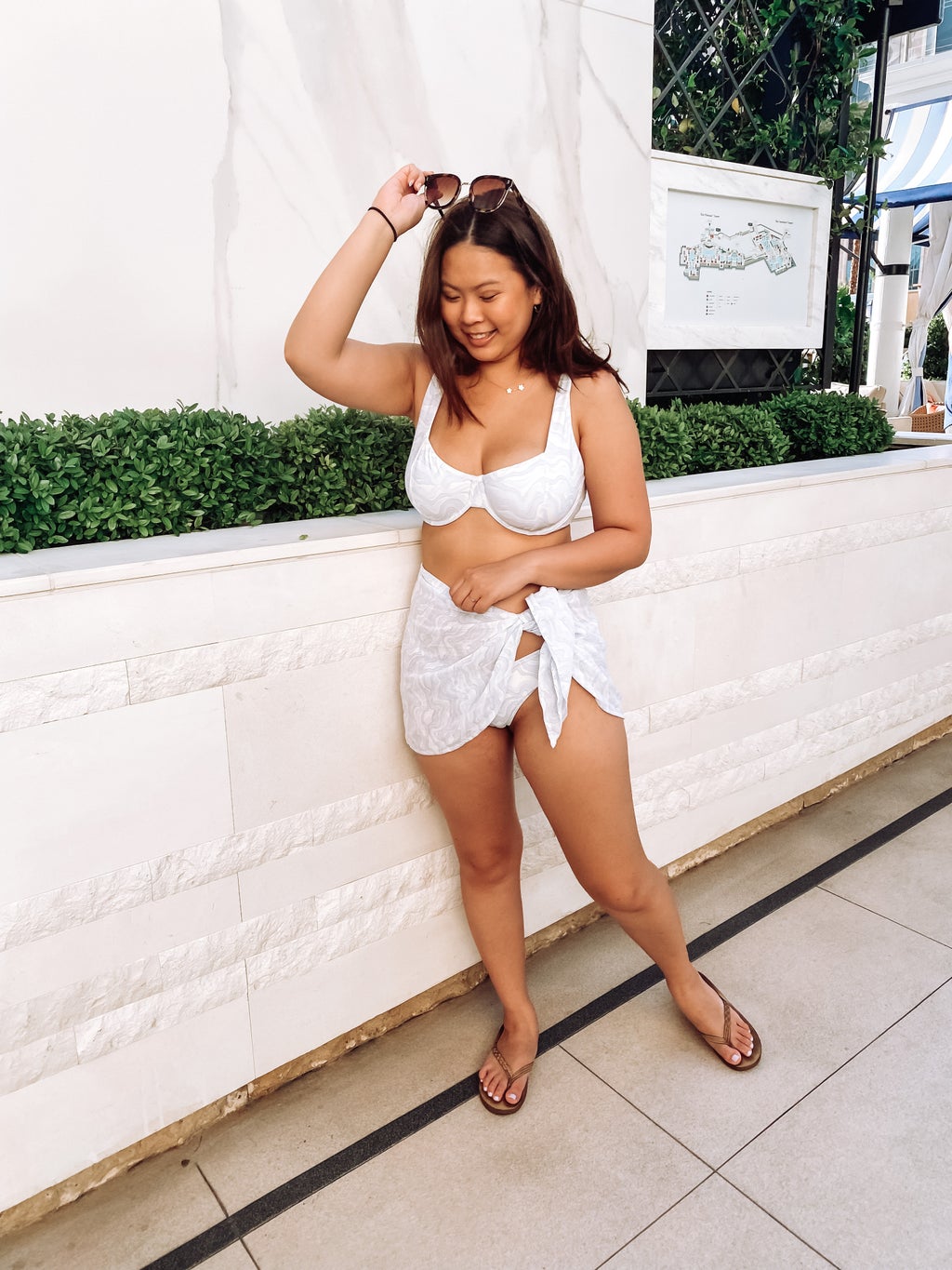 woman in Abercrombie swimsuit in pool