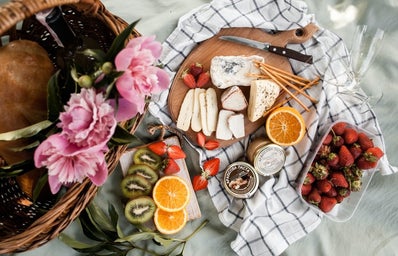 charcuterie board with fruit and cheese