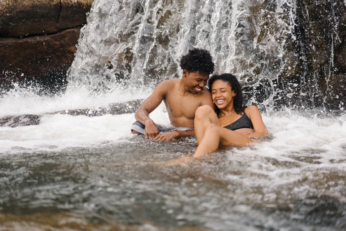 couple smiling in waterfall by Briona Baker?width=698&height=466&fit=crop&auto=webp