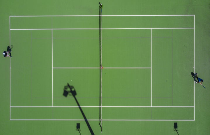 two people playing tennis by Mudassir Ali?width=719&height=464&fit=crop&auto=webp