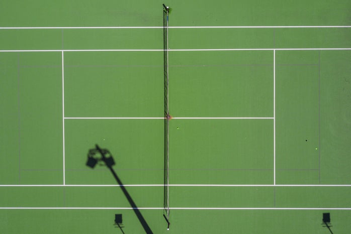 two people playing tennis by Mudassir Ali?width=698&height=466&fit=crop&auto=webp